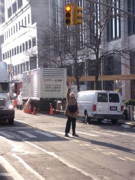 Ken Gale standing under one of the traffic lights submerged by Hurricane Sandy, photo by Will Morgan